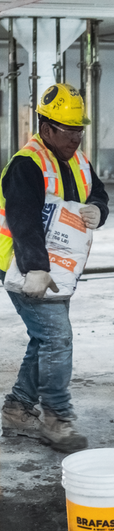 picture of worker carrying grout bag