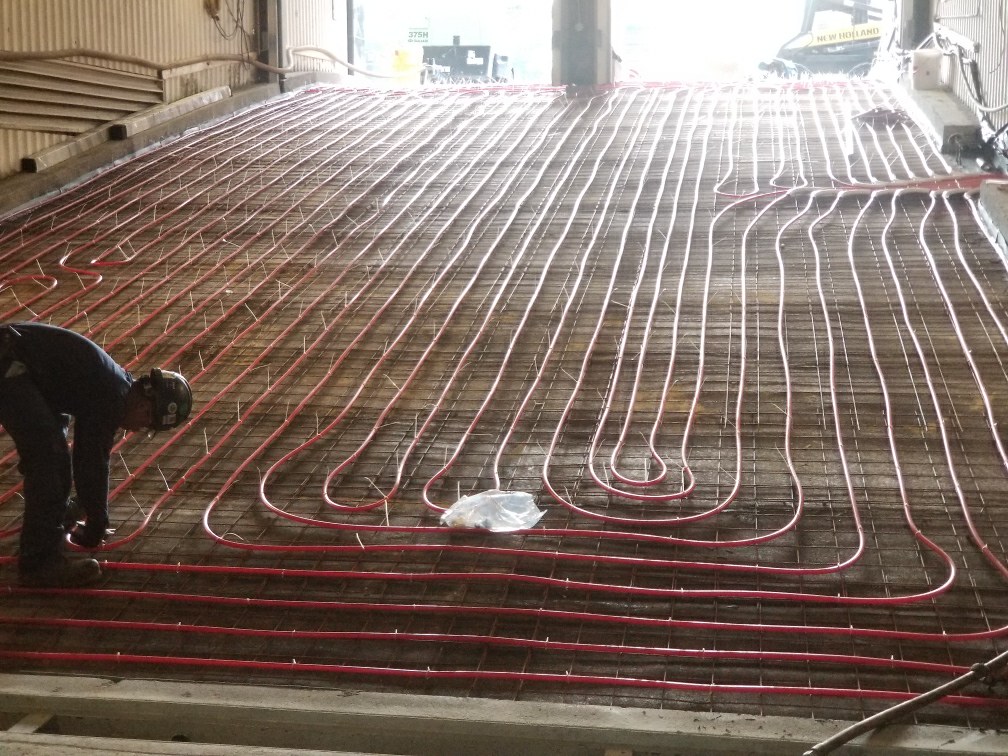 Image of waterproofing being applied to a slab