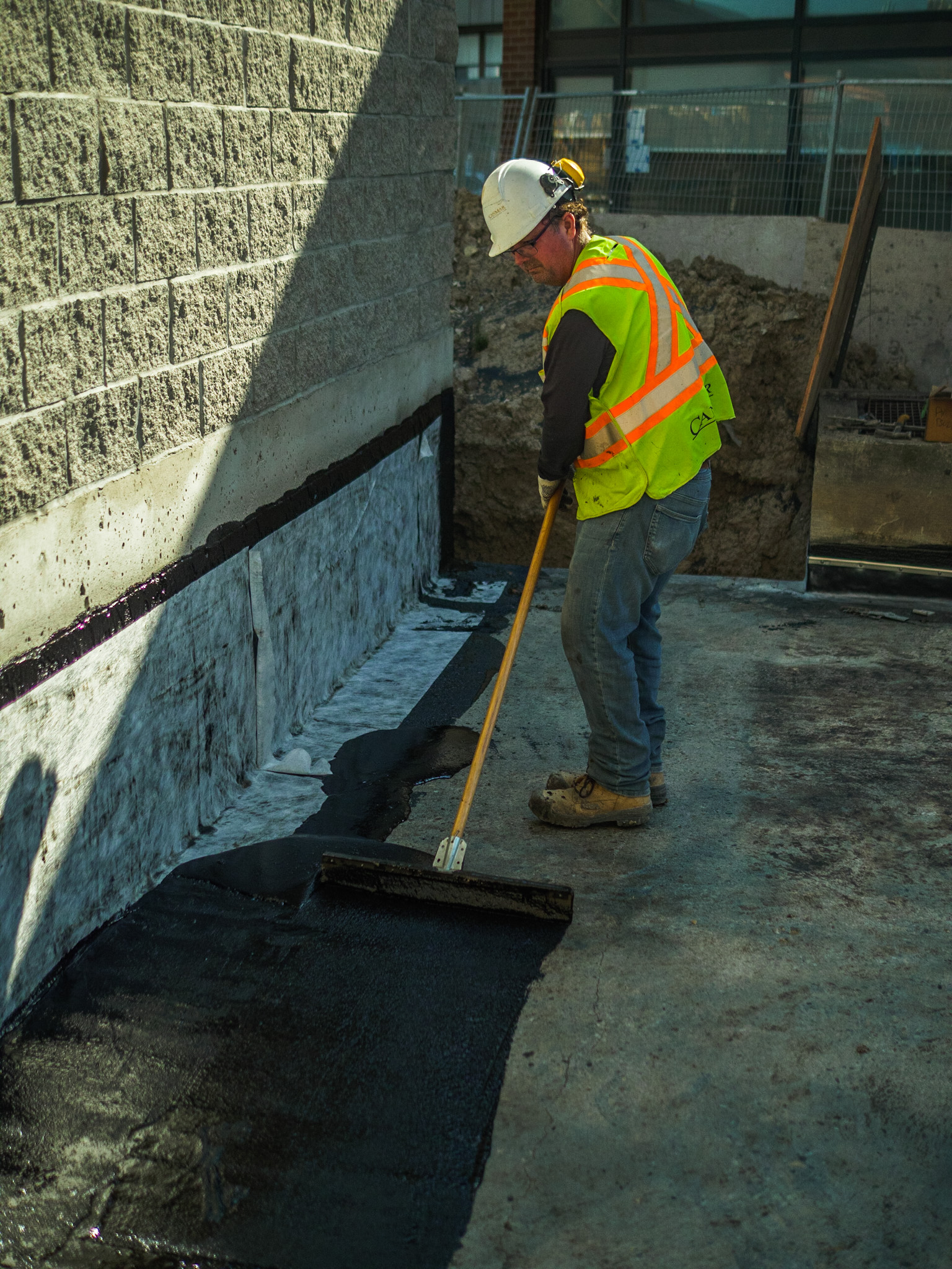 Image of waterproofing being applied to a slab